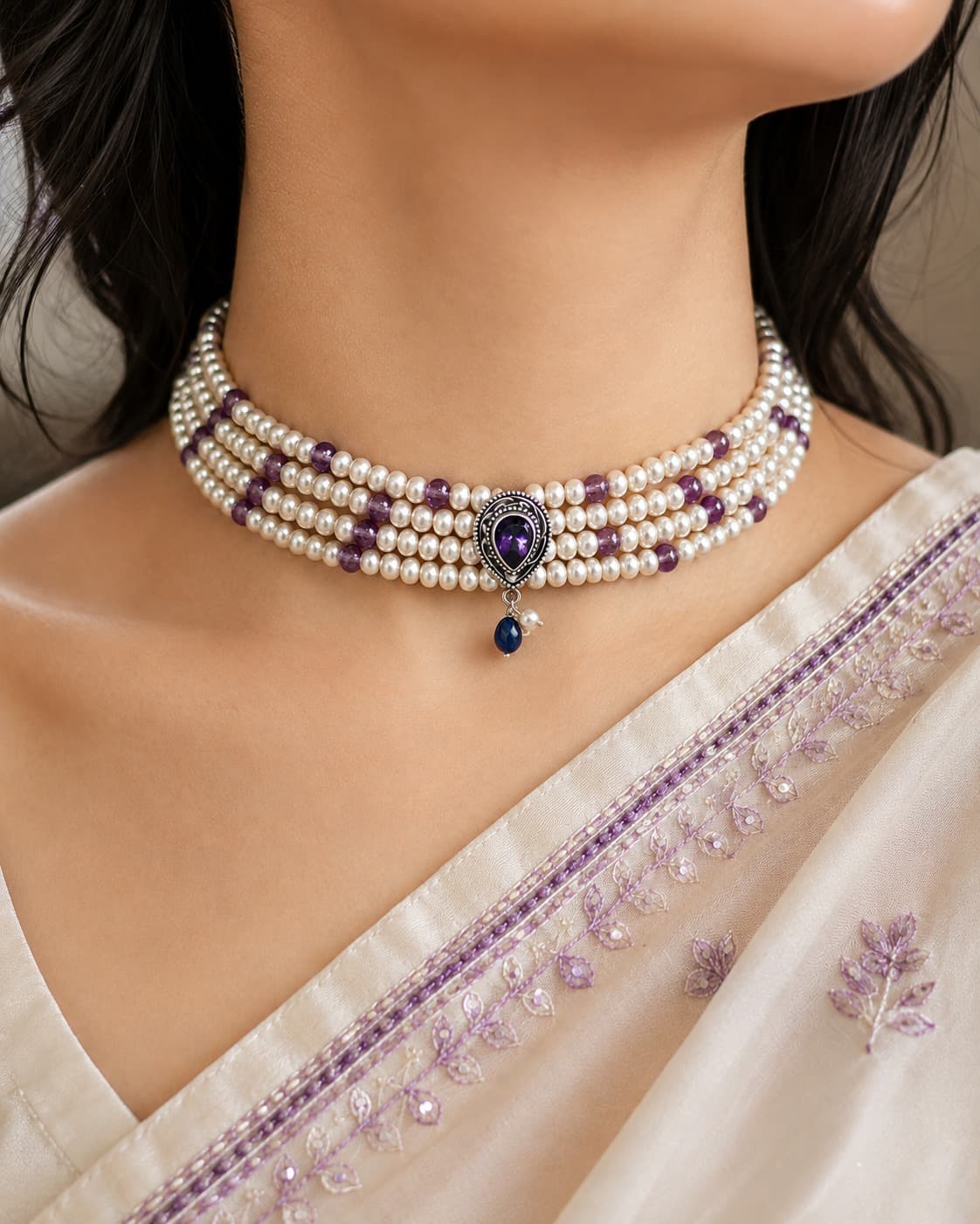 Pearl and amethyst choker on a model in an ivory saree — Nizam heritage